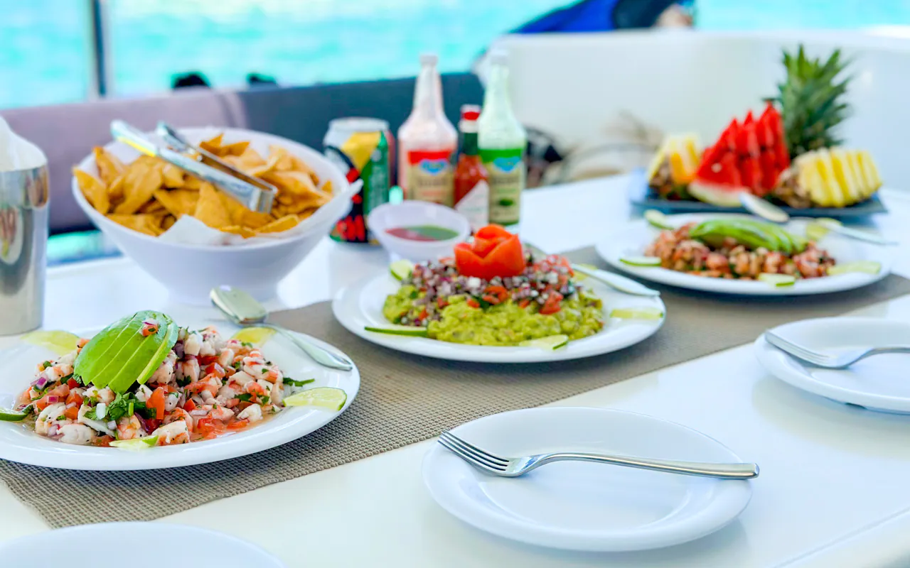 Fresh ceviche, guacamole, and fruit served onboard